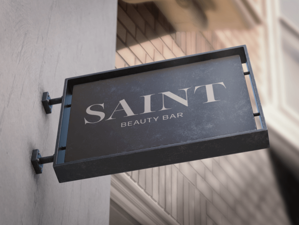 An outdoor sign showing Saint Beauty Bar's logo