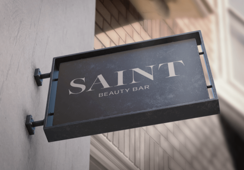 An outdoor sign showing Saint Beauty Bar's logo